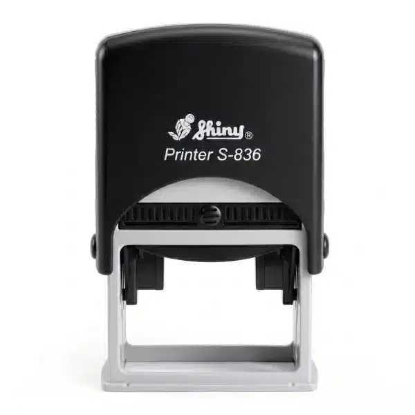 Shiny S-836 - 45x30 mm. sello automático rectangular 2 Vista frontal del sello automático Shiny Printer S-836 de 45×30 mm con carcasa negra y visor transparente